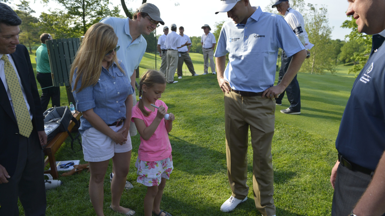 Addie McGarry marks the ball to be used by Bill Haas